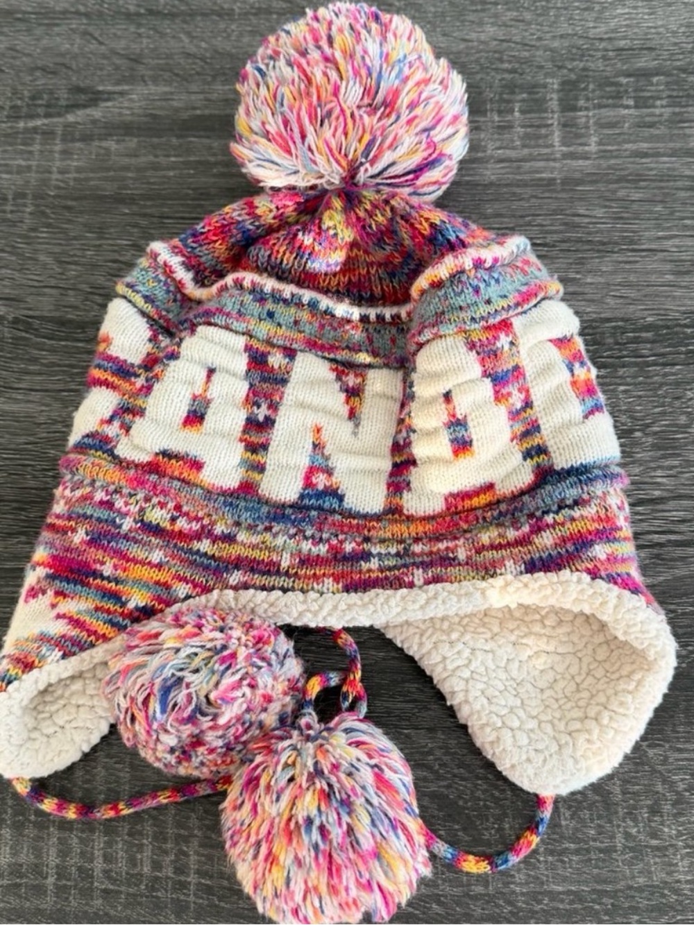 Robin Ruth Multicolor Knit Earflap Hat with White Lettering